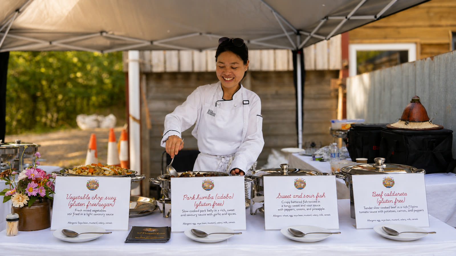 Filipino Fiesta Food chef beside the buffet at an event